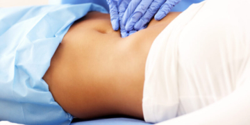 Picture of adult woman having a visit at female doctor's office